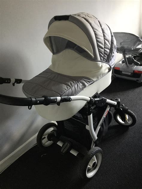 white lux pram.